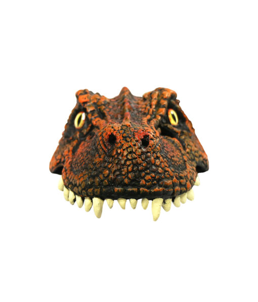 Half mask with dinosaur dragon design, orange scales and orange eyes.