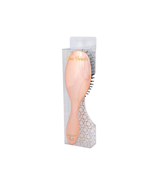 Oval hair brush in peach colour with black bristles