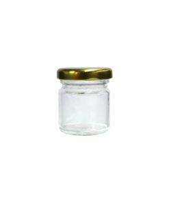 Clear glass storage jar with gold lid in dimensions 5.4cm x 4.4cm x 5.3cm